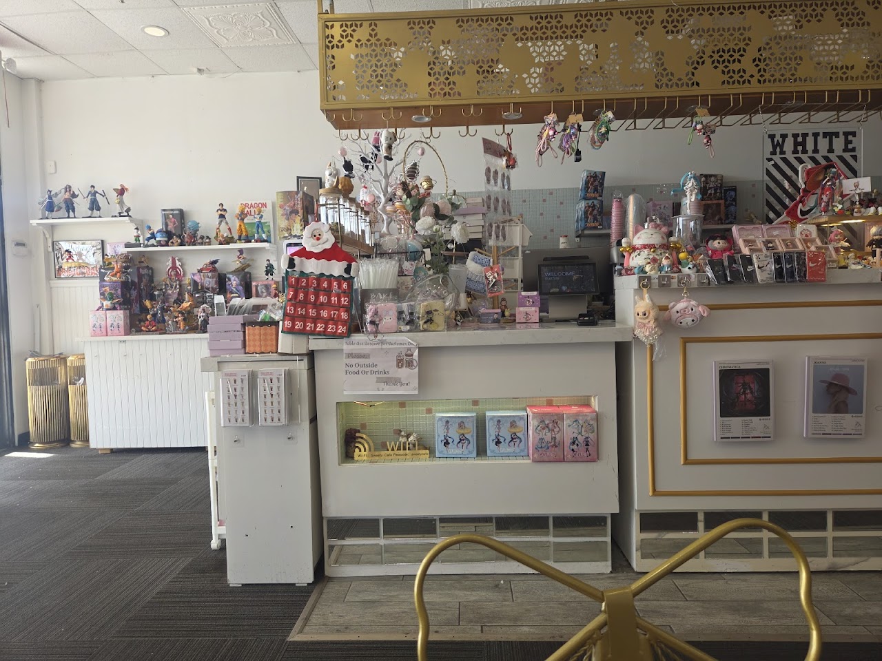 Sweety Cafe seating area with kawaii wall decor